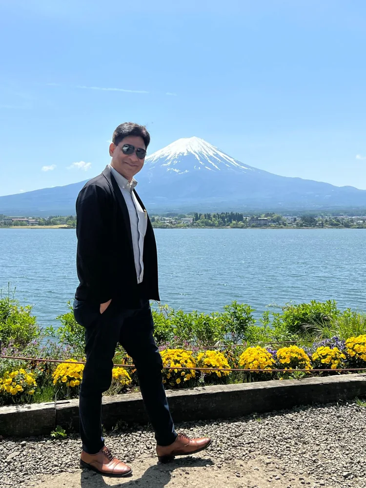 Ramesh Sharma visiting Japan, with Mount Fuji in the background